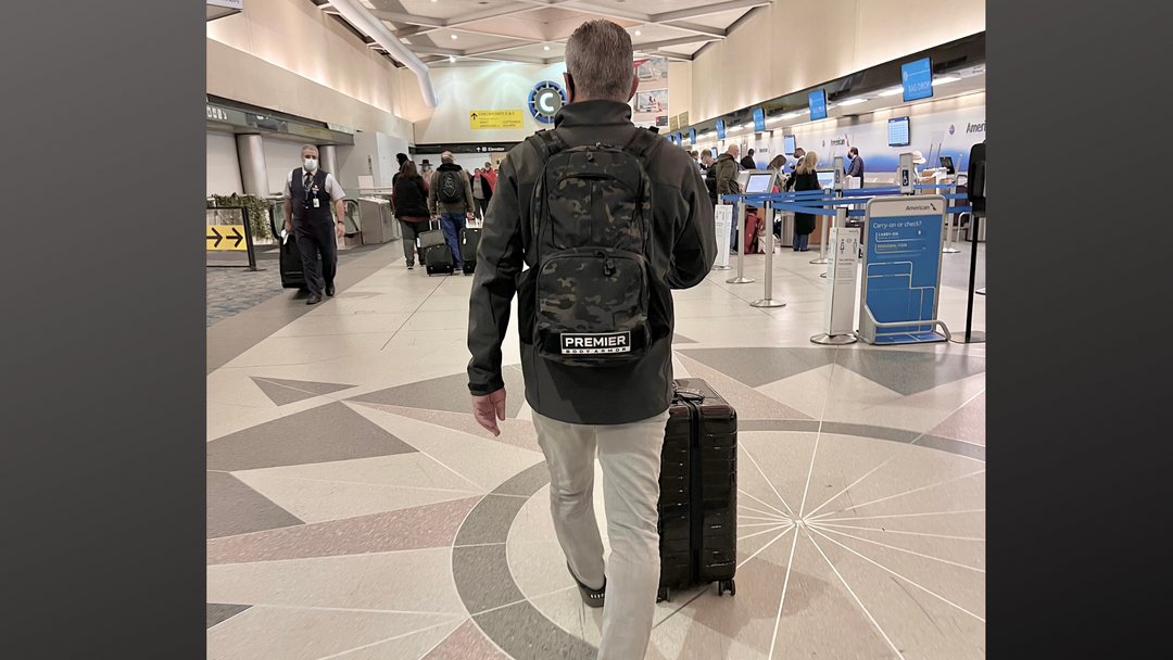 Image of traveling through airport security with an bulletproof body armor.