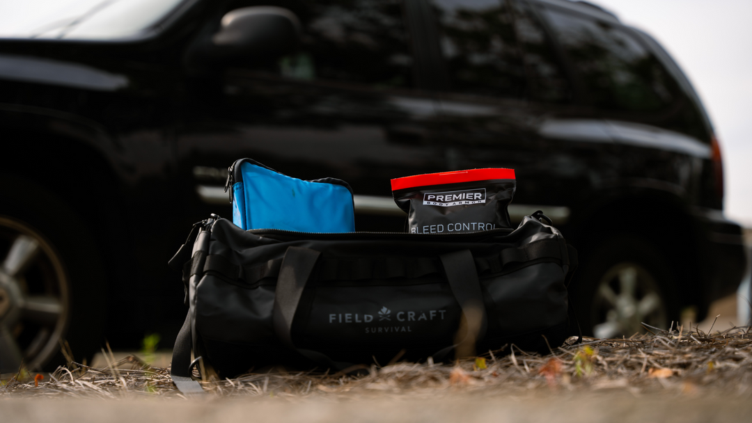 car with first aid kit that includes bleed control tools