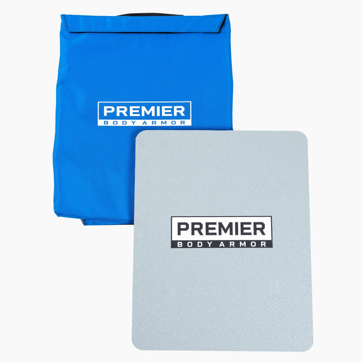 A piece of body armor and a blue carrying case are displayed. Both items feature the "Premier Body Armor" logo. The rectangular Level III+ First Aid Shield is placed in front of the blue case, which is partially open at the top. This setup ensures school safety and serves as an essential emergency response kit.