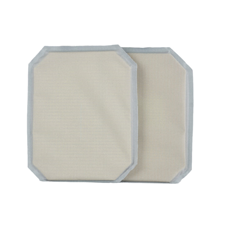 Two rectangular beige pads with grayish borders, the 6x8 Cummerbund Armor Set by Premier Body Armor, are shown overlapping on a white background. With rounded corners and soft texture, they offer Level IIIA ballistic protection.
