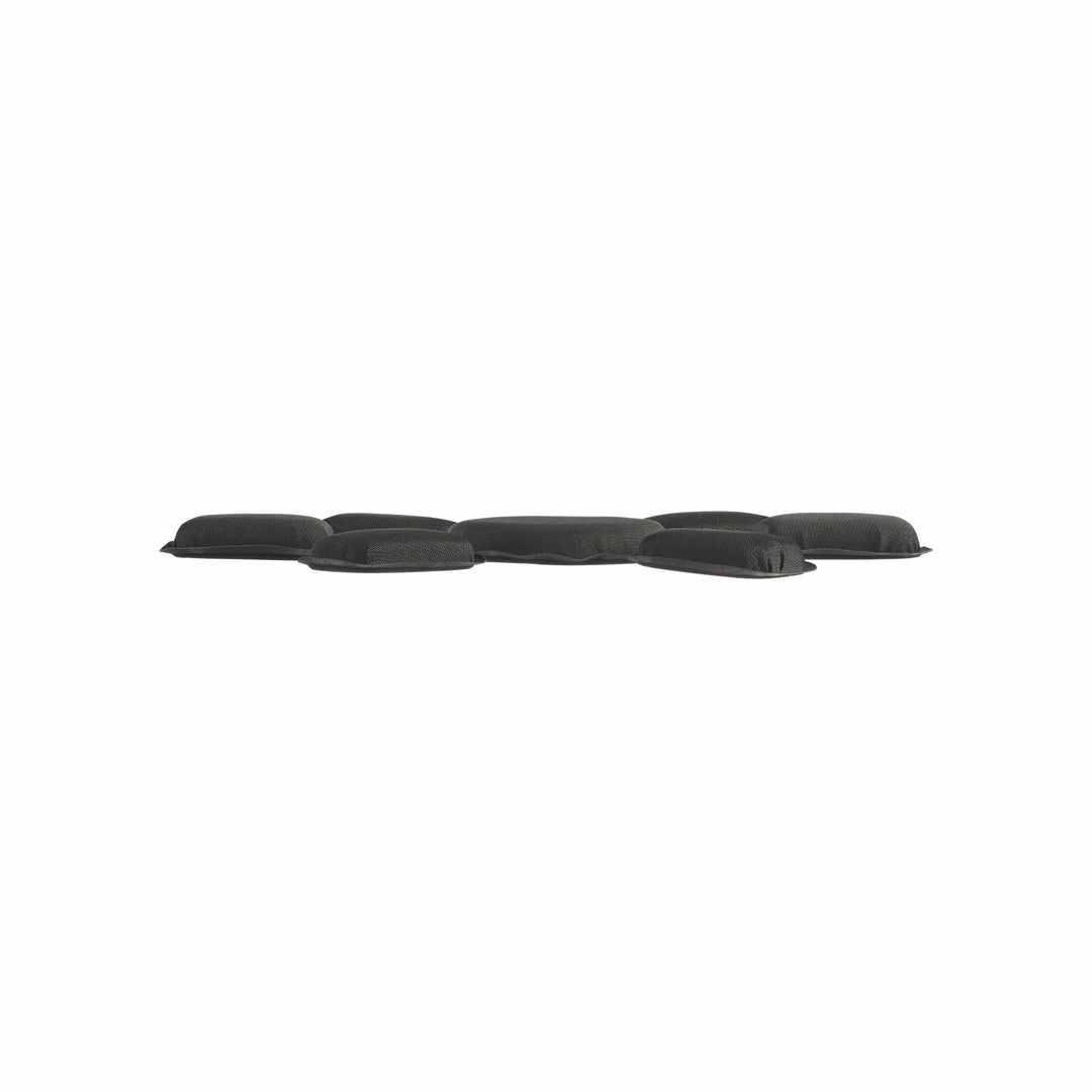 A low-profile, black cushion with an irregular shape against a white background, the D3O Stealth Helmet Pad System features interconnected, rounded segments for blunt impact protection and appears slightly elevated.