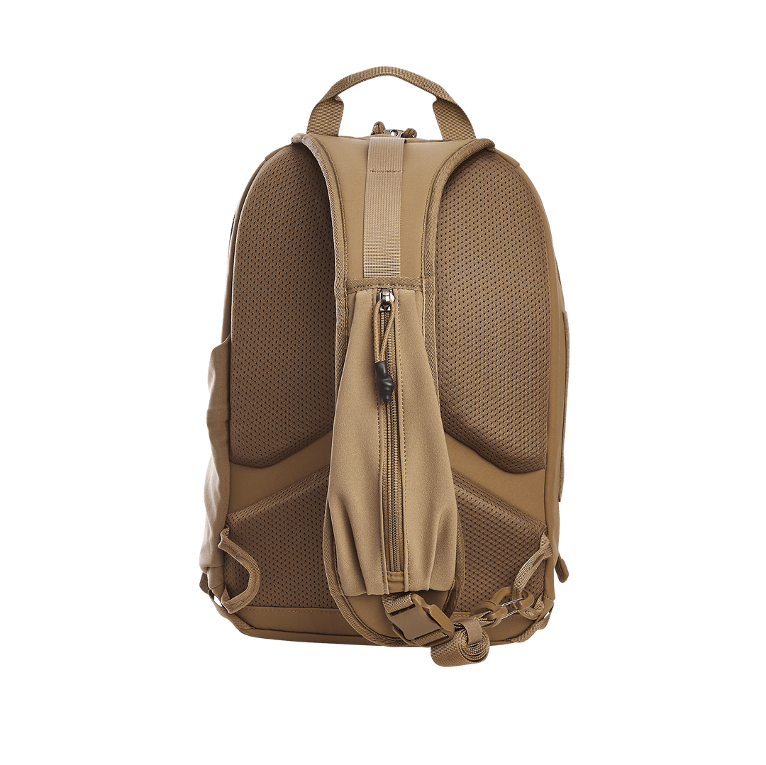 A tan backpack, echoing the Vertx Siege 15L Tactical Sling by Vertx, is depicted from the back with padded straps and a central zippered pocket. It features mesh comfort padding, an adjustable bottom strap, suggesting tactical readiness against a green backdrop.