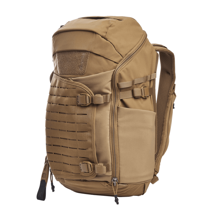 The Vertx Siege 25L Tactical Pack in Coyote offers versatile functionality with multiple compartments and zippers. It features adjustable shoulder straps, side buckles, and a Velcro patch. Its sturdy design ensures tactical readiness for any outdoor adventure.