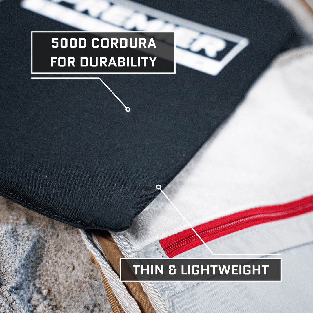 Close-up of a Vertx Siege Pack with labels: "500D Cordura for durability" on black fabric and "Thin & Lightweight" on a red zipper, highlighting the Premier Body Armor Vertx Siege Pack Level IIIA/HG2 Backpack Insert's discreet armor capabilities.