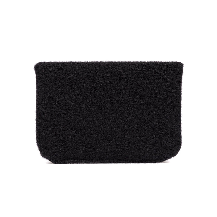 A rectangular black textured pouch, closely resembling the Premier Body Armor SOE FUPA Level IIIA Insert, is displayed against a plain white background. The pouch appears soft and fuzzy, with no visible zippers or handles.