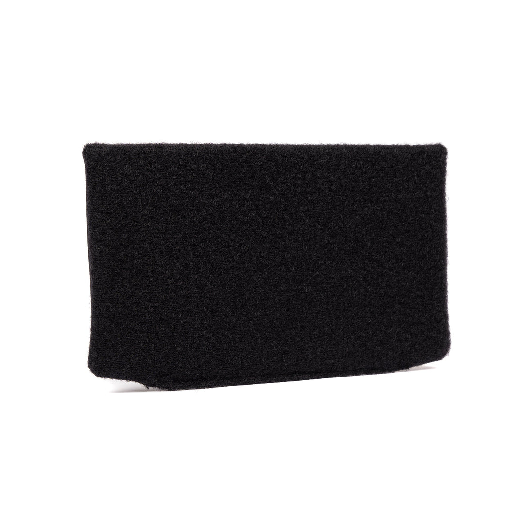 A Premier Body Armor SOE FUPA XL Level IIIA Insert, a black rectangular object with a textured surface, is possibly made from ballistic material or upholstery. The object appears to be freestanding against a white background.