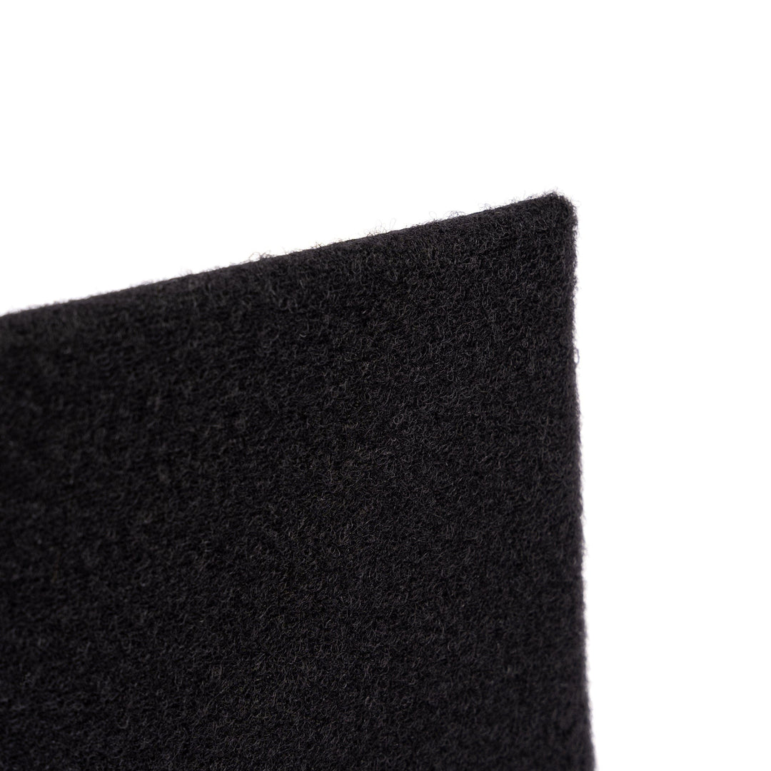 Close-up of a Premier Body Armor SOE FUPA XL Level IIIA Insert, displaying its black felt-like material cut into a triangular shape with a smooth edge. The texture is soft and slightly fuzzy, resembling the feel of ballistic material. No other objects or context are visible in the image.