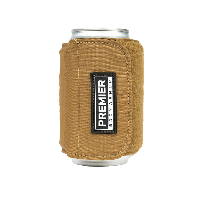 A can of beverage is encased in a brown Bulletproof Can Cooler from Premier Body Armor. The koozie features a label with "Premier Body Armor" in black and white, indicating NIJ - Level II protection with ballistic fibers. The background is plain white.