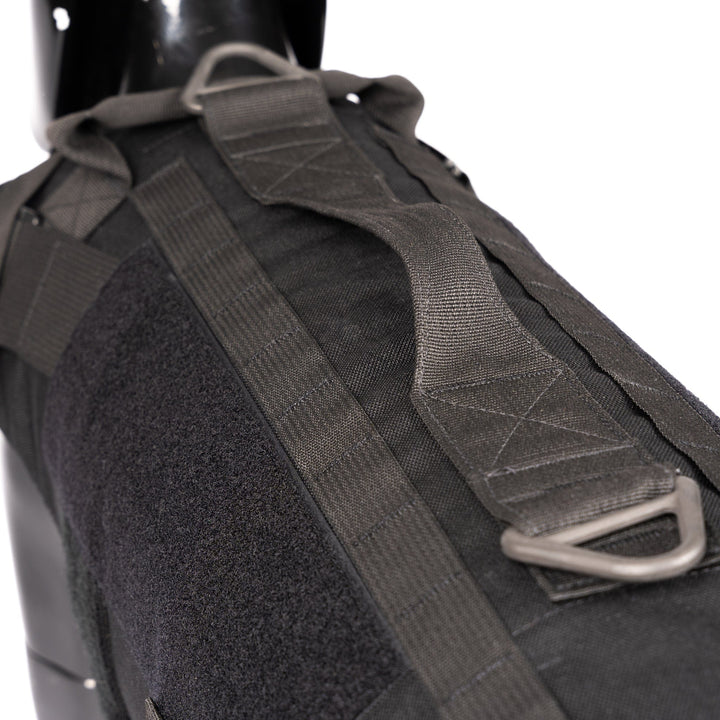 An up-close view of the black onyx/Premier Body Armor K-9 Vest – Level IIIA on a mannequin against a white backdrop highlights its durable fabric, adjustable straps with metal D-rings, and Velcro patch area for enhanced functionality.