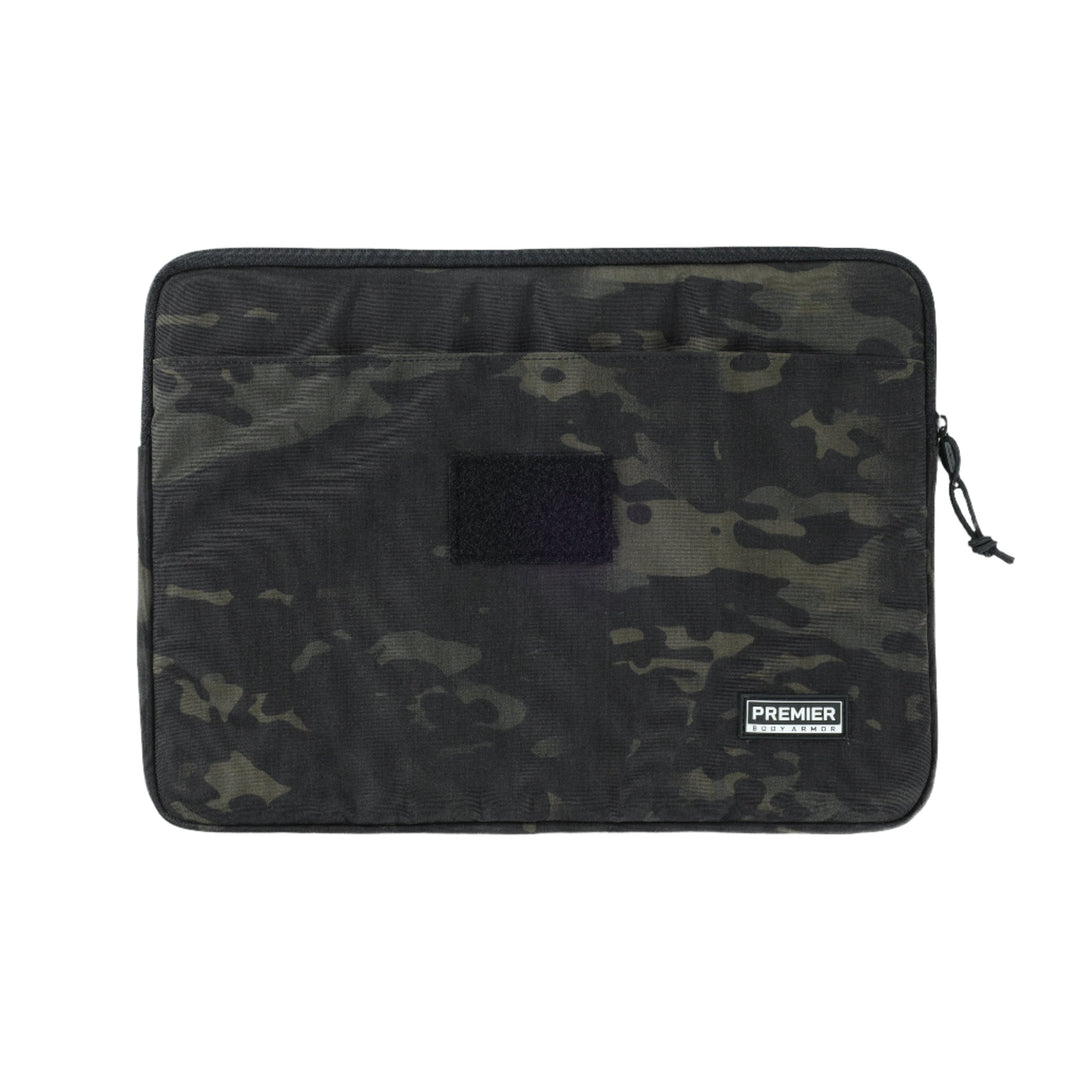 The Bulletproof Laptop Case from Premier Body Armor is a black camo-patterned zipper pouch designed to fit most electronics accessories while offering Level IIIA protection that meets NIJ ballistic standards. The front features an open pocket and a Velcro patch, with the Premier logo label near the bottom right corner.