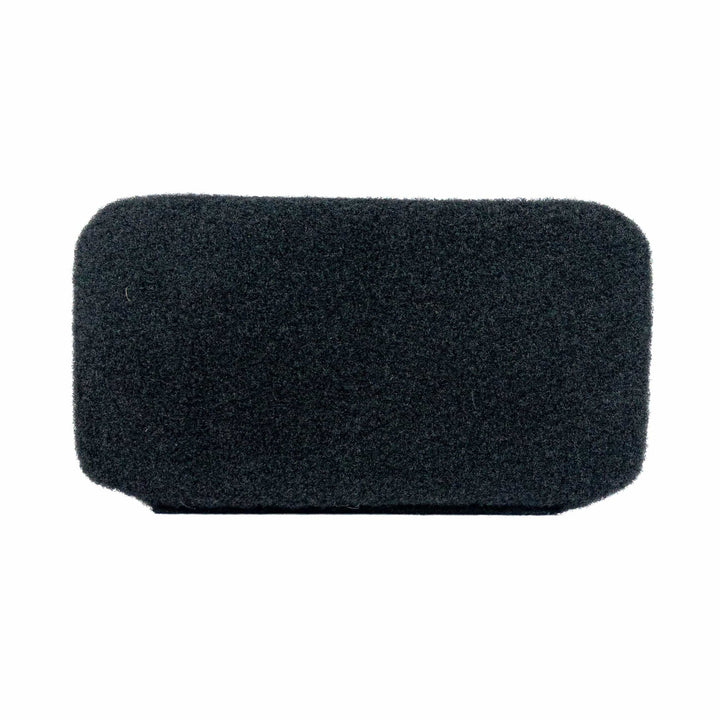 A rectangular black foam microphone windscreen rests against a white background, resembling the sleek design of an Eberlestock Bando Bag XL Level IIIA Insert by Premier Body Armor with its minimalist allure.