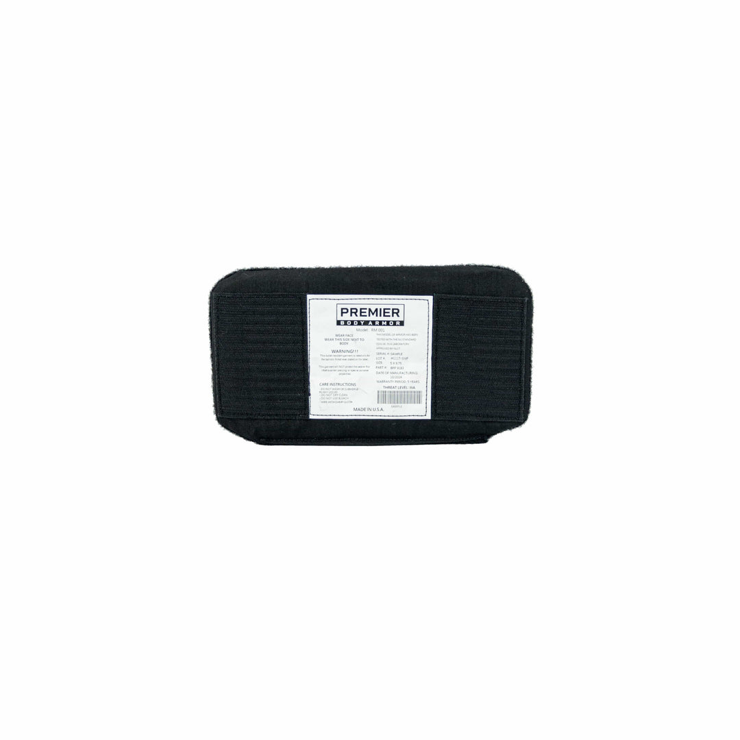 A disposable hot surface cleaning pad from Premier Body Armor is displayed in black, offering quality akin to that expected from an Eberlestock Bando Bag XL Level IIIA Insert. The rectangular pad features a ribbed texture and a white label in the center with product details.