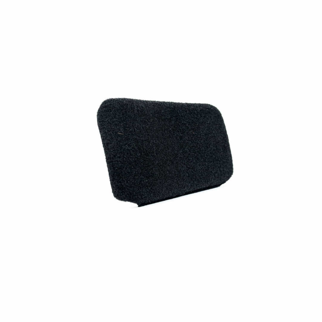 The Eberlestock Bando Bag XL Level IIIA Insert by Premier Body Armor is a small, rectangular black foam cover with a textured surface and rounded edges, resembling a ballistic panel. Positioned against a plain white background, it appears slightly angled to reveal its smooth contours.