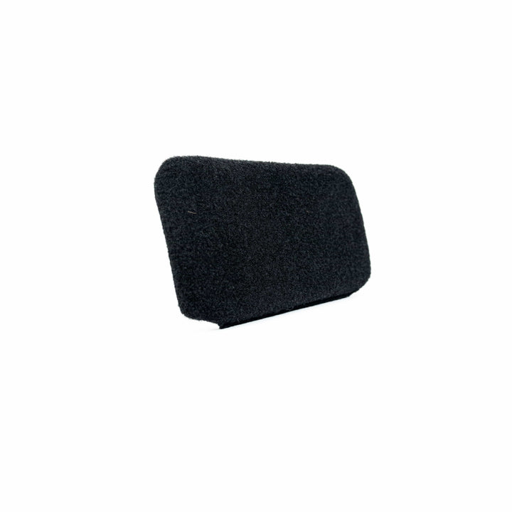 The Eberlestock Bando Bag XL Level IIIA Insert by Premier Body Armor is a small, rectangular black foam cover with a textured surface and rounded edges, resembling a ballistic panel. Positioned against a plain white background, it appears slightly angled to reveal its smooth contours.