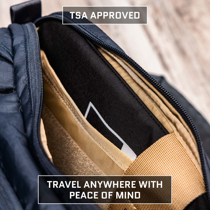 Open travel bag revealing tidy compartments for fans of tactical hip packs. Overlay text reads "TSA Approved" atop and "Travel Anywhere with Peace of Mind" below. Bag rests on wood, ideal for Viktos Upscale Hip Pack enthusiasts. Product: Armored Viktos Upscale Hip Pack Bundle by Viktos/Premier.