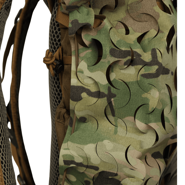 A close-up of the OPE Gear Backpack Scrim - Camouflage Pack Cover by OPE Gear, highlighting its camouflage pattern, Cordura nylon construction, laser-cut slits, mesh padding, and detailed stitching.
