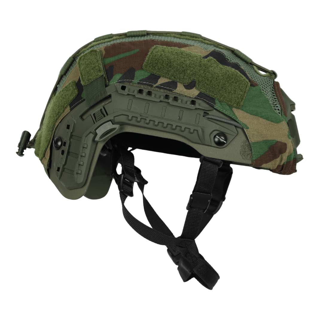 Fortis Bump Helmet Cover on a tactical bump helmet featuring woodland camouflage, side accessory rails, and an adjustable chin strap.