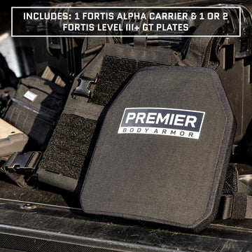 A close-up image of tactical body armor gear, including the Fortis Level III+ GT Loadout by Premier Body Armor, showcases the essential ballistic protection trusted by tactical professionals. The equipment is meticulously laid out on what appears to be the back of a vehicle.