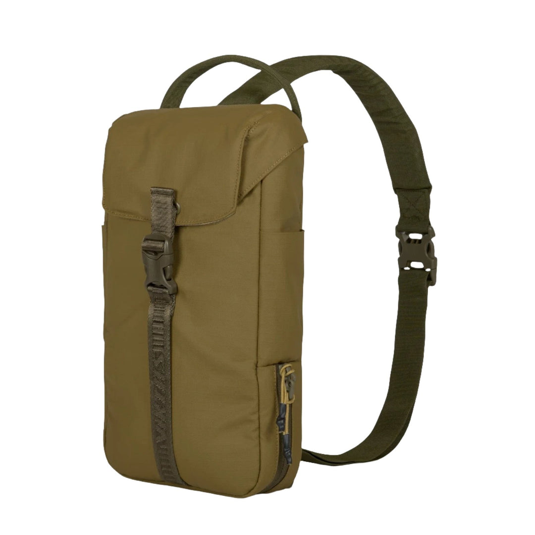 The Viktos Counteract CCW Slingbag by Viktos/Premier is a khaki green sling bag featuring a fold-over flap secured by a buckle, a front zipper pocket, a convenient side zip, and an adjustable single strap. This minimalistic and practical design also accommodates firearm carry for everyday use.