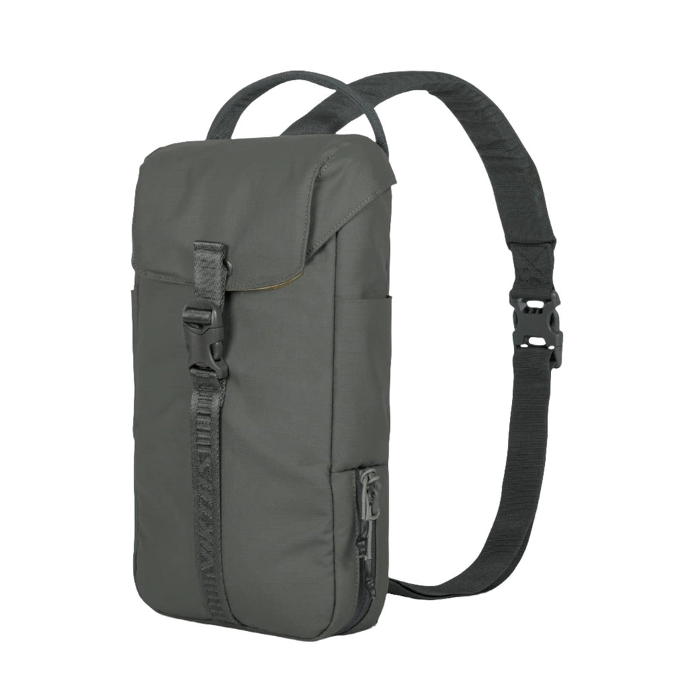 The Viktos/Premier Counteract CCW Slingbag is a compact, gray, rectangular bag featuring a front flap secured by a buckle and an adjustable black strap. It includes a side zipper pocket and has an elongated main compartment specifically designed for easy firearm carry, with additional space for a body armor insert.