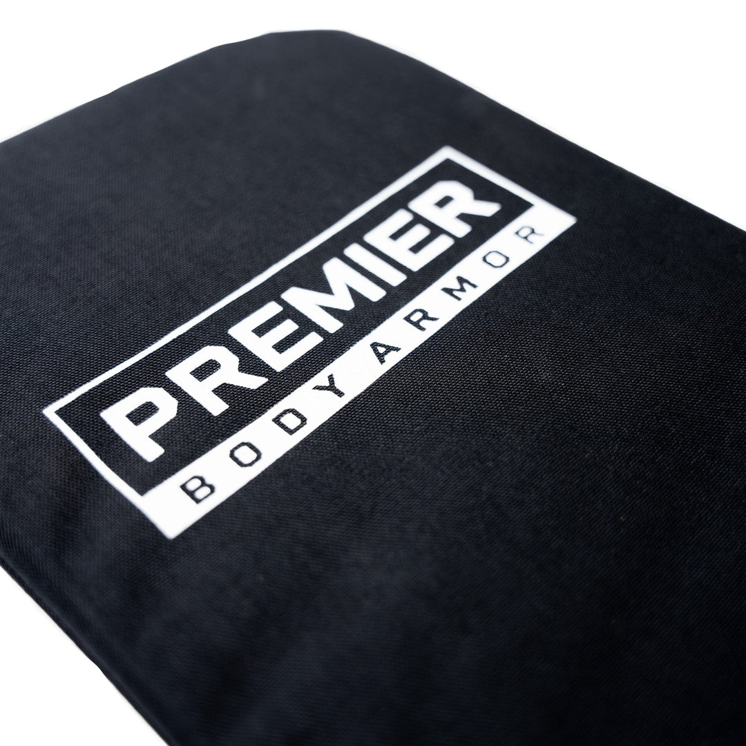 Close-up of the Vertx Long Walks 15L Level IIIA Insert by Premier Body Armor, featuring prominently displayed text "PREMIER BODY ARMOR" in white. This black ballistic panel fits snugly into the Vertx Long Walks Pack, offering enhanced protection.