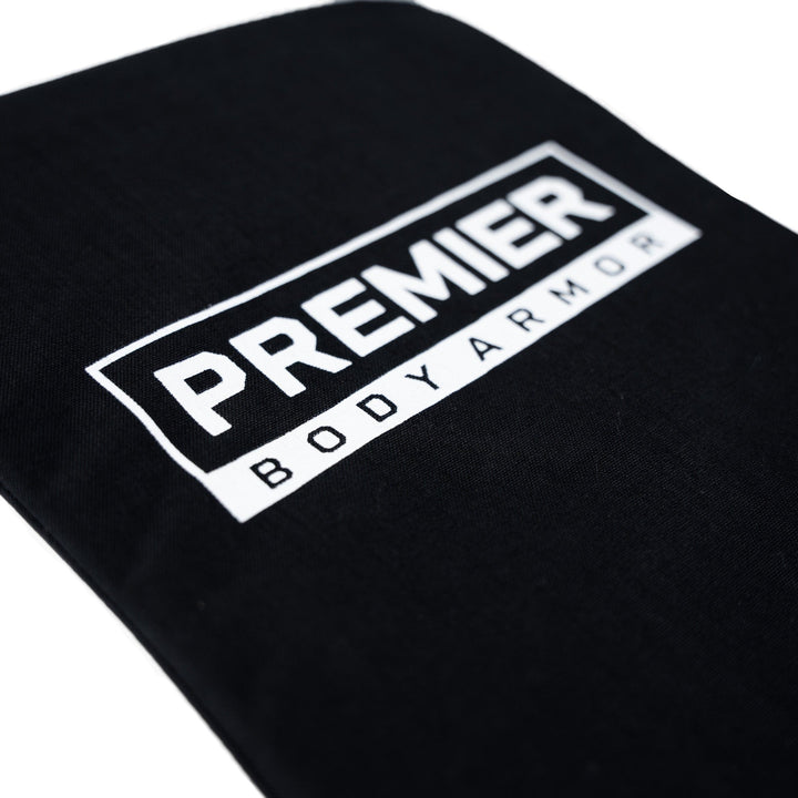 A close-up of a black fabric with the text "PREMIER BODY ARMOR" printed in white, showcasing the sleek design of the Vertx Long Walk 28L Level IIIA Insert.