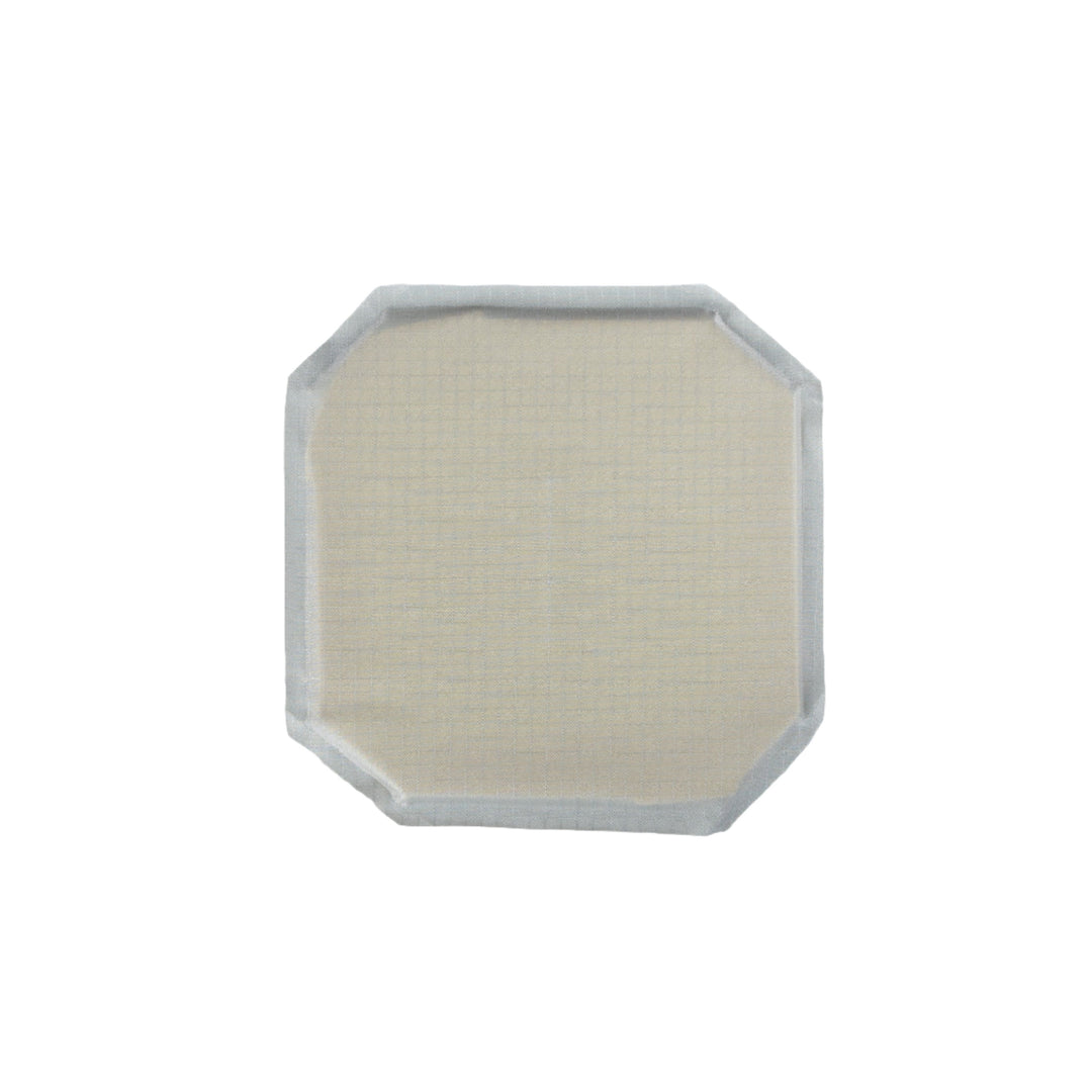 A white square patch with rounded corners and a slightly textured surface, appearing to be a 6x6 Cummerbund Armor from Premier Body Armor, is shown on a white background. It has a thin outer border and a gridded pattern on its surface, reminiscent of materials used for Level IIIA protection.