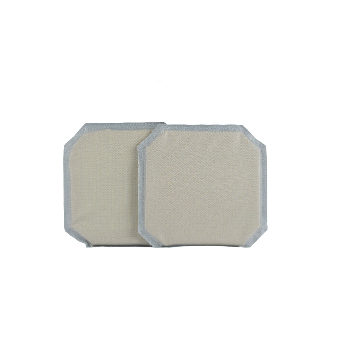 Two beige rectangular fabric patches with rounded corners and grey borders are laid side by side against a plain white background. The patches boast a simple, minimalist design and appear to be used for clothing or textile repairs, subtly reminiscent of the structured form of Premier Body Armor's 6x6 Cummerbund Armor.