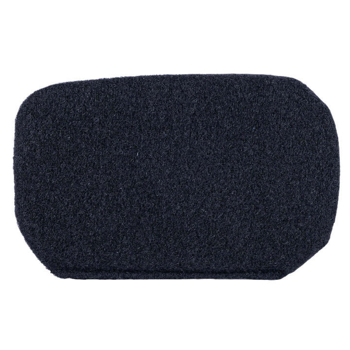 A black scrub pad, resembling the textured durability of the Viktos/Premier Armored Viktos Upscale Hip Pack Bundle with its rectangular shape and slightly rounded corners, is shown on a plain white background for cleaning tasks.