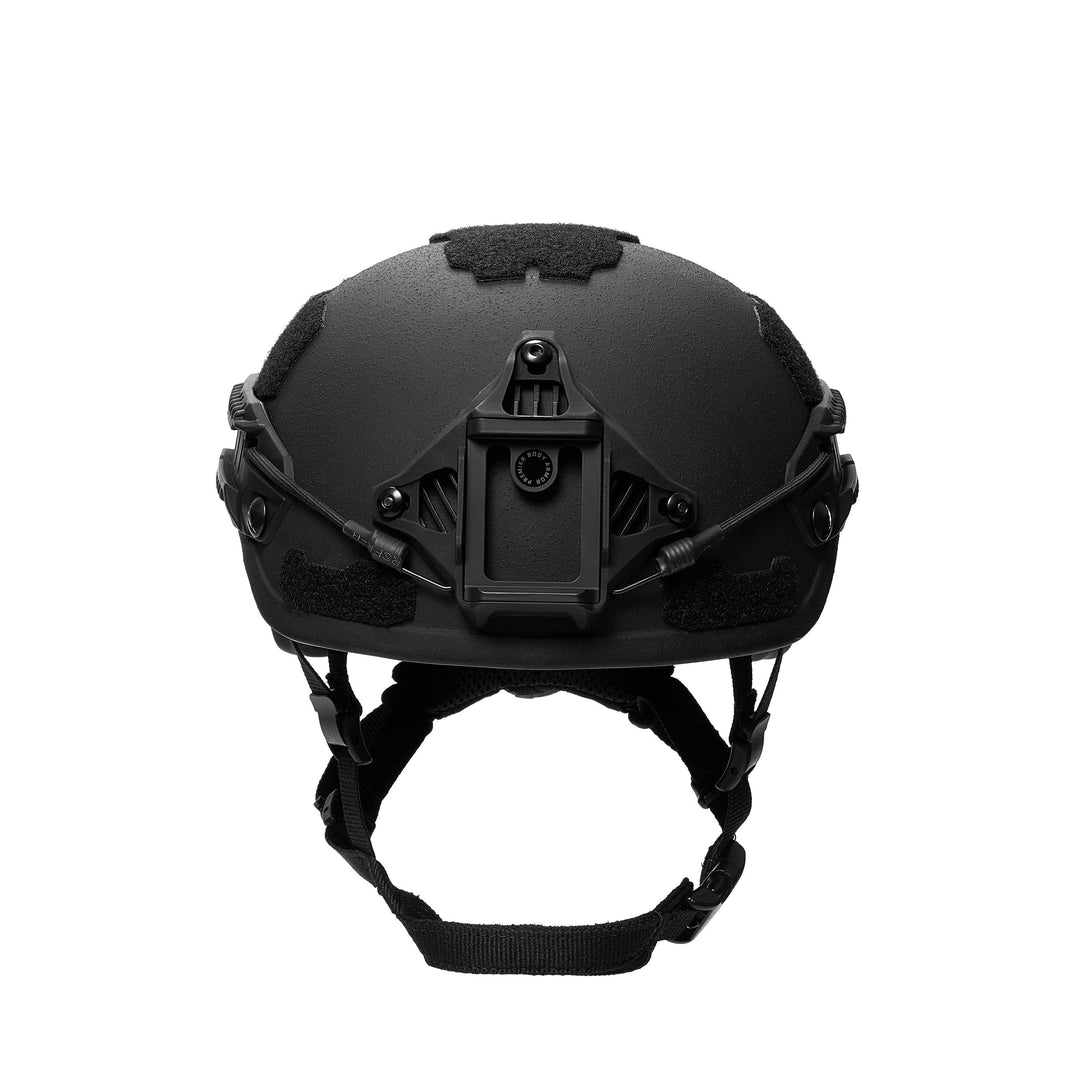 Front view of the black Fortis Ballistic Helmet by Premier Body Armor, featuring a mounting bracket, adjustable chin straps, and Velcro patches on the side and top for attachments. The design is sleek and utilitarian with advanced protective technology.