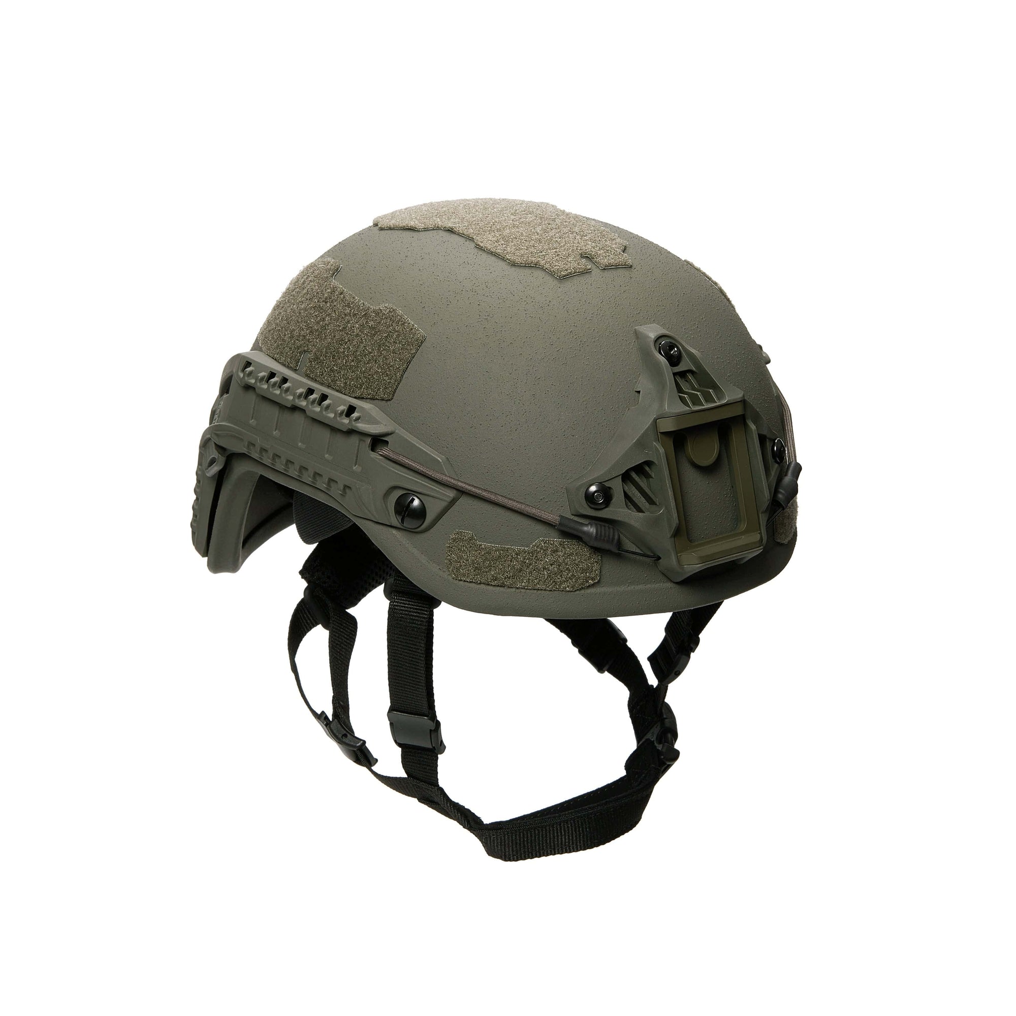 The Premier Body Armor Fortis Ballistic Helmet comes with a green matte finish, adjustable straps, and mounting rails. Made with advanced ballistic fibers for superior energy dispersion, it also includes textured patches to easily attach accessories or camouflage material.