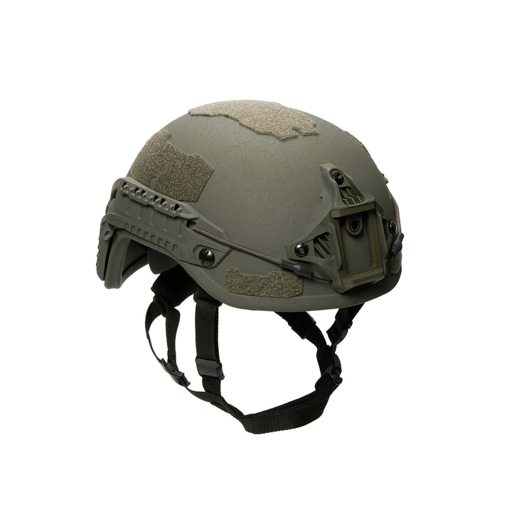 The Fortis Ballistic Helmet by Premier Body Armor is a lightweight olive green tactical helmet featuring advanced protective technology, side attachment rails, a front mounting bracket, Velcro patches, and an adjustable chin strap for optimal security.