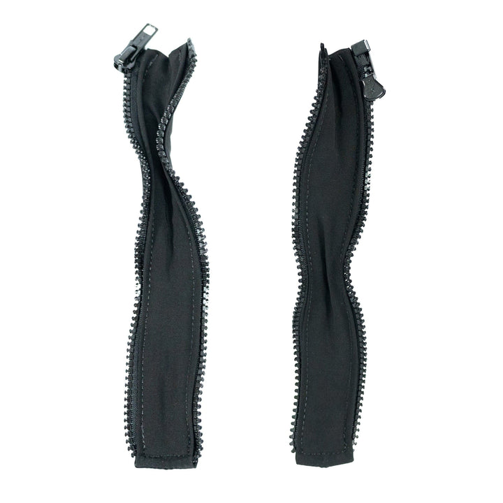 Two black fabric zippers, from Premier Body Armor's "Extenders for Discreet Executive Vest," have plastic teeth and are parallel on a plain white background, each with a pull tab. The fabric shows slight wrinkles.