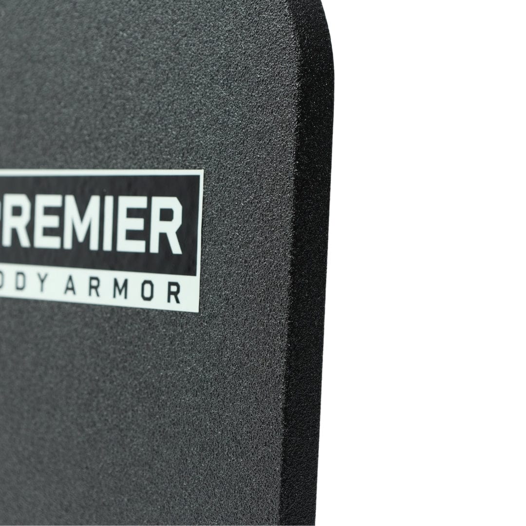 A close-up of a black, textured armor panel labeled "Premier Body Armor," partially cropped. Shown is the 10x15 Special Threat Rifle-Rated Backpack Insert by Premier Body Armor, designed for use as an NIJ ballistic backpack insert.