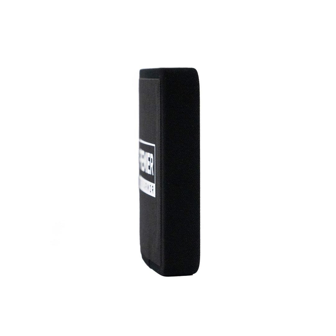 A side view of the black rectangular Fortis III+/RF1 Side Plate Set by Premier Body Armor, featuring a white logo, is set against a plain white background, highlighting its sleek design and reliability.