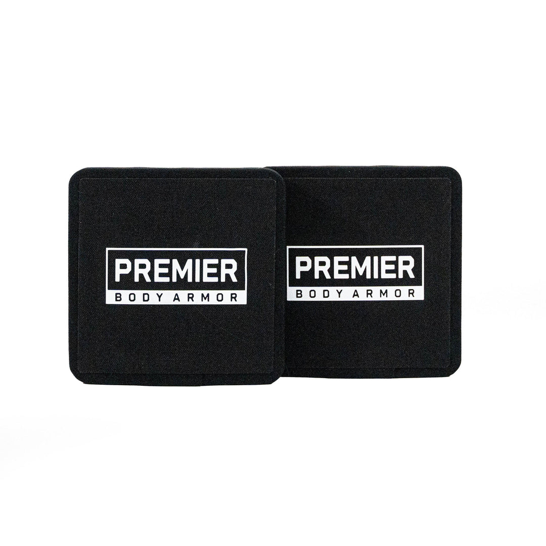 The Fortis III+/RF1 Side Plate Set, featuring two black square panels with "Premier Body Armor" in white, is displayed side by side on a white background, representing reliability and meeting top body armor standards.