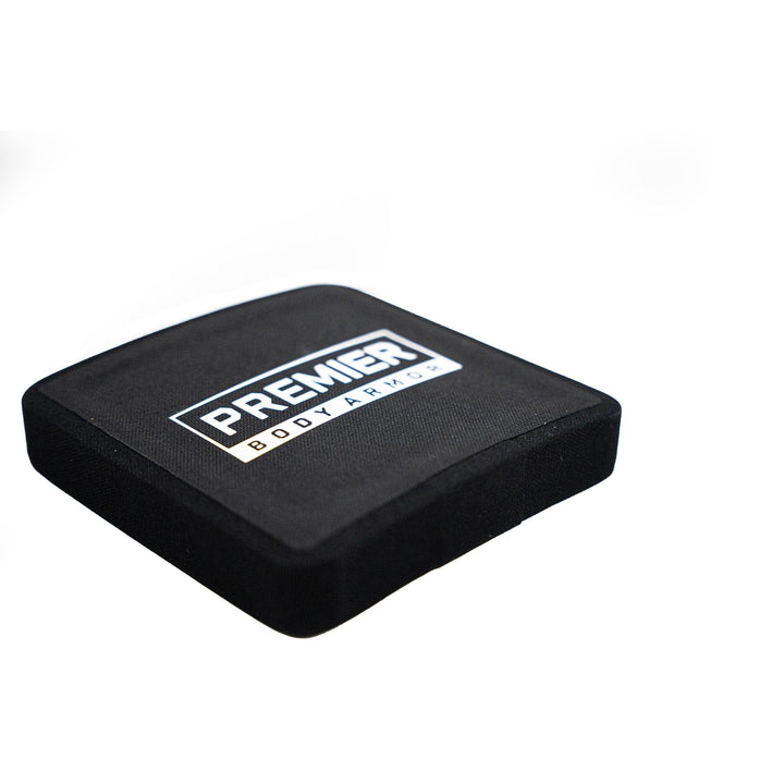 The Fortis III+/RF1 Side Plate Set by Premier Body Armor features a black square ballistic panel with the logo in white. Known for reliability, the panel has a fabric covering and is shown against a white backdrop.