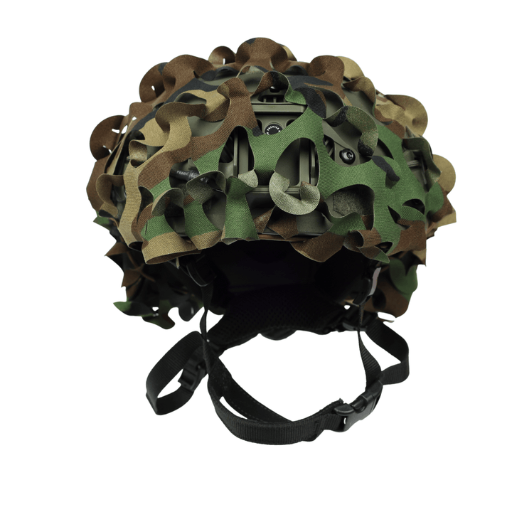 The OPE Gear Helmet Scrim - Camo Helmet Cover by OPE Gear in green, brown, and tan camo is shown on a military ACH helmet with a black adjustable chin strap against a white background.