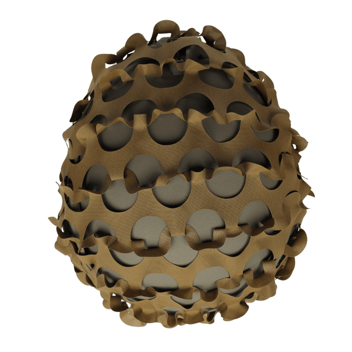 The OPE Gear Helmet Scrim - Camo Helmet Cover by OPE Gear features an irregular, wavy brown design with circular holes that reveal a smooth gray base, giving your helmet an organic, sculptural look reminiscent of tactical gear.