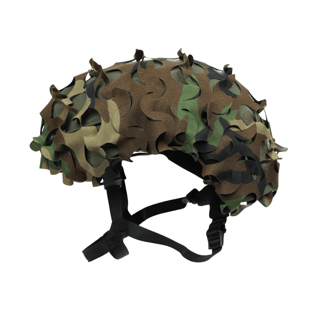 The OPE Gear Helmet Scrim - Camo Helmet Cover by OPE Gear features an M81 Woodland pattern, leaf-like textured scrim, and adjustable black chin strap, shown on a camouflage ACH helmet isolated on white.