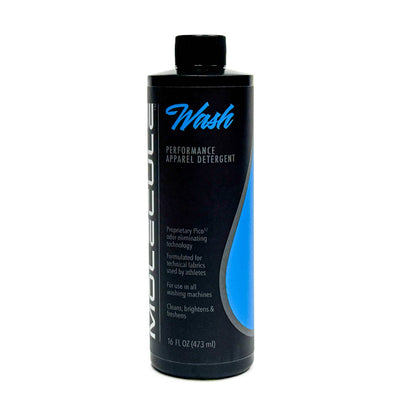 A black bottle of Molecule Vest & Carrier Detergent with a blue label stands upright on a white background. Specially formulated as a duty uniform detergent, this 16 fl oz (473 mL) bottle with a black cap is designed to care for technical fabrics and enhance moisture management.