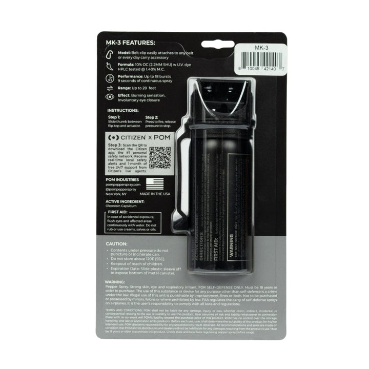 Back view of a POM MK-3 Pepper Spray canister by POM, shown in a clear blister pack with visible product info, instructions, cautions, and barcode. The black professional-grade self-defense spray is securely packaged.