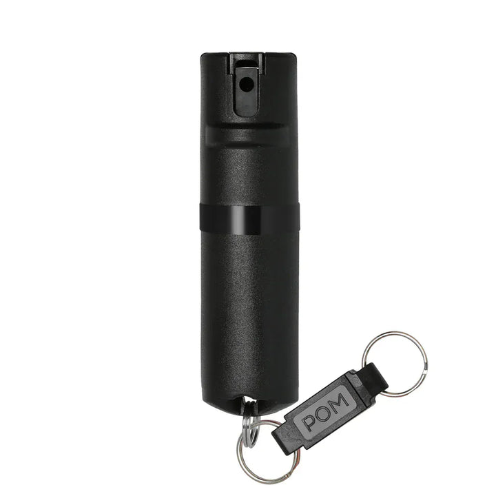 The POM Keychain Pepper Spray by POM is a small black compact canister with a keychain attachment, displayed against a plain white background.