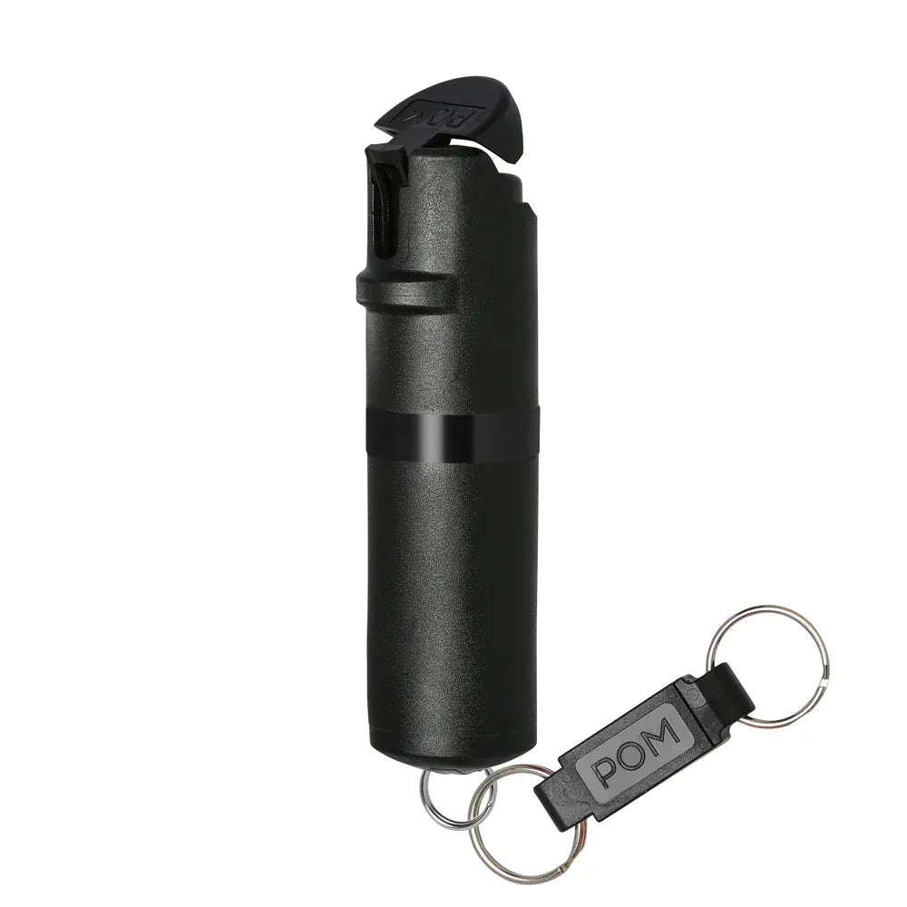 The POM Keychain Pepper Spray by POM features a safety cap, black center band, and convenient keychain attachment for easy carrying and quick access in self-defense situations.