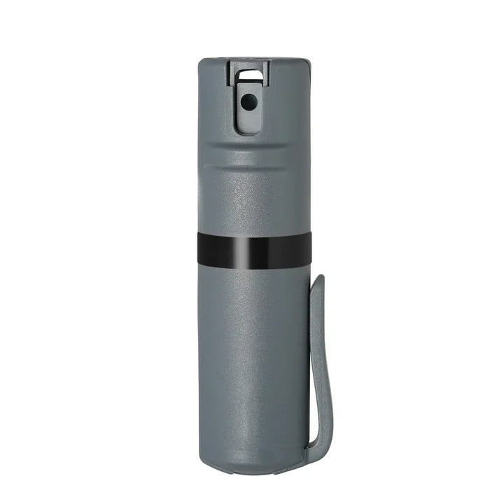 The POM Clip Pepper Spray by POM is a compact gray cylindrical canister with a black band and side pocket clip, shown upright against a white background.