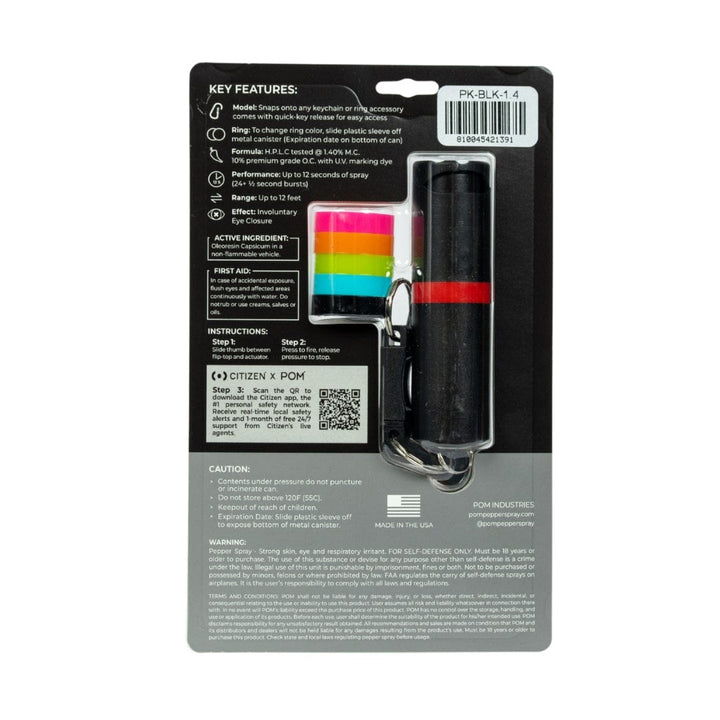 The POM Keychain Pepper Spray by POM features a black canister with a rainbow quick-release keychain, packaged on a card that details its compact self-defense benefits, instructions, cautions, and warnings.