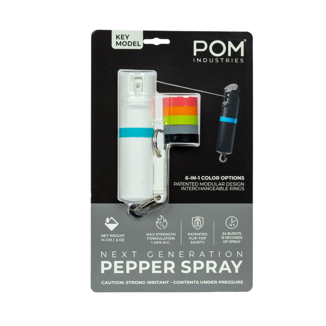 A package includes the POM Keychain Pepper Spray by POM, featuring interchangeable colored rings, a quick-release keychain, modular design, patented safety technology, and 6-in-1 color options.