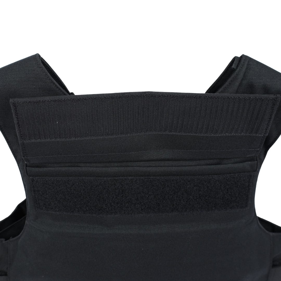 Close-up of the upper section of the Premier Body Armor Patrol Delta vest, highlighting its black color, reinforced stitching, multiple fabric layers, Velcro fastening straps, and MOLLE webbing for modular attachment.