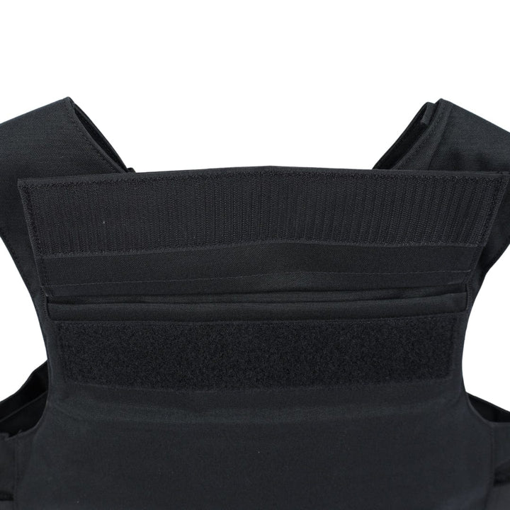 Close-up of the upper section of the Premier Body Armor Patrol Delta vest, highlighting its black color, reinforced stitching, multiple fabric layers, Velcro fastening straps, and MOLLE webbing for modular attachment.