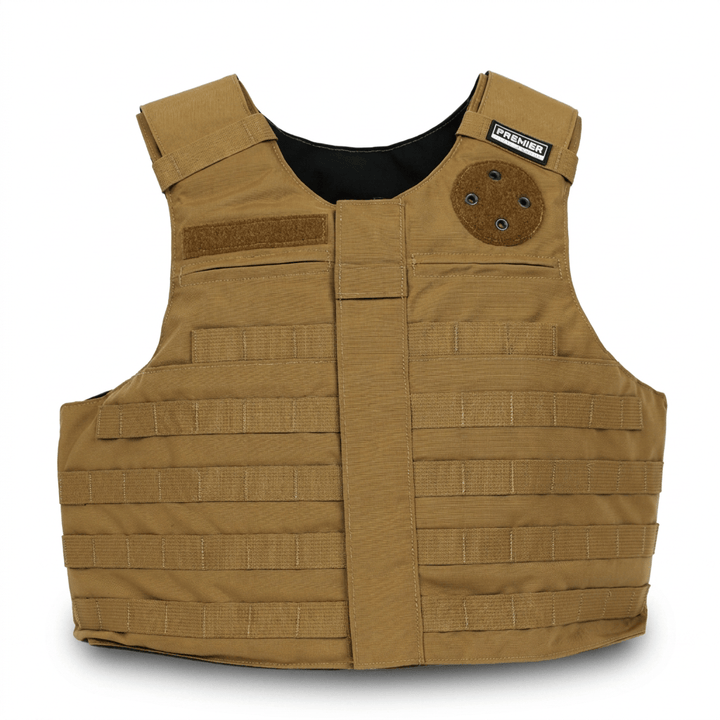 The Premier Body Armor Patrol Foxtrot is a tan tactical body armor vest with MOLLE webbing on the front, adjustable shoulder straps, a patch on the right shoulder, and a circular attachment on the left chest. This MOLLE carrier provides Level IIIA soft armor protection and is shown against a white background.